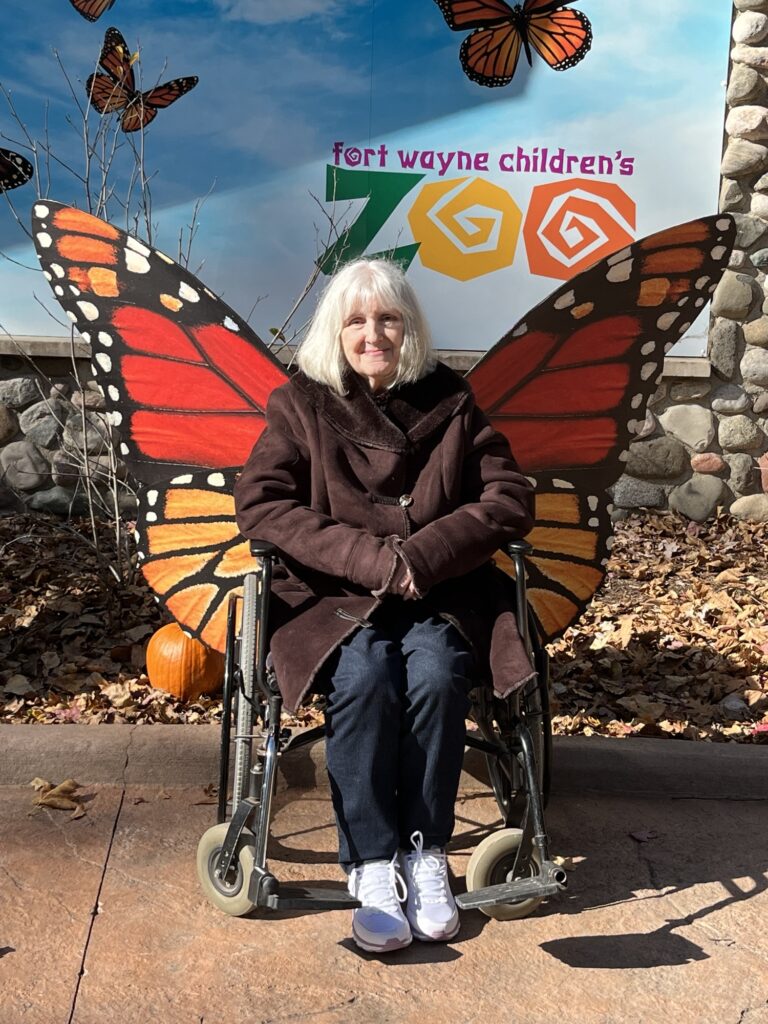 Mom vising the zoo with us a few years ago.